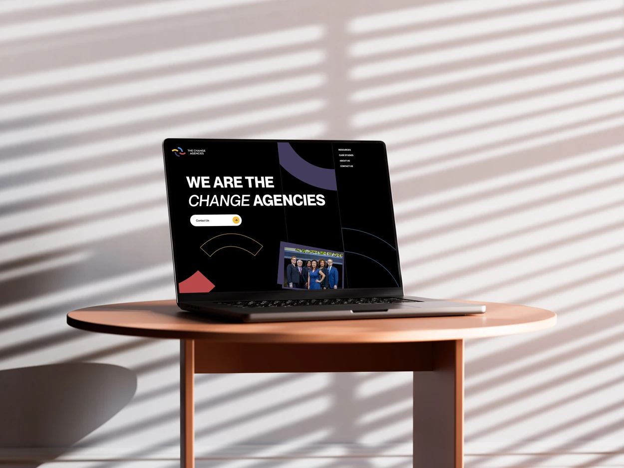 The Change Agencies website on a laptop