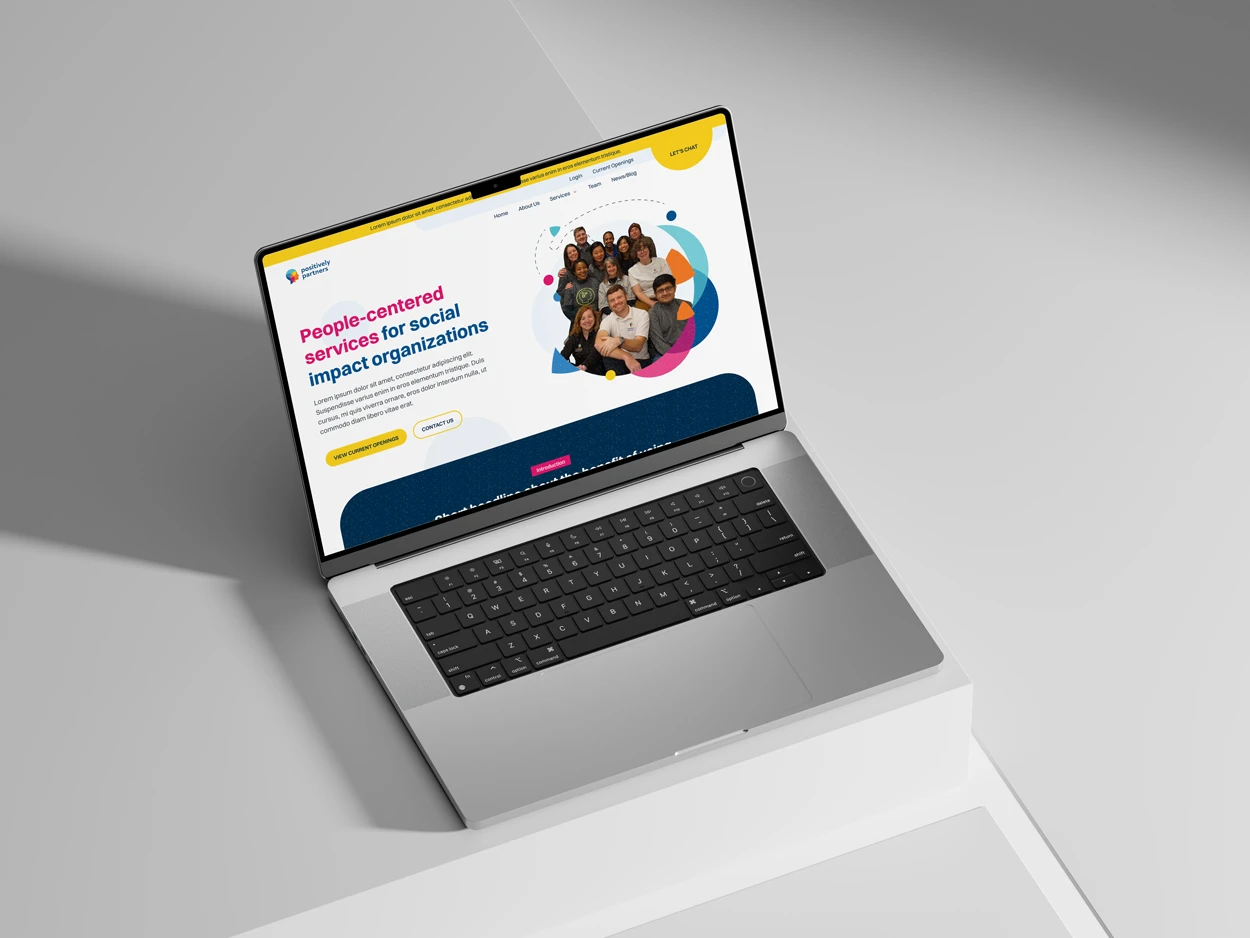 Positively Partners website on a laptop